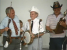 Ralph presents Curly Ray with an award c1986